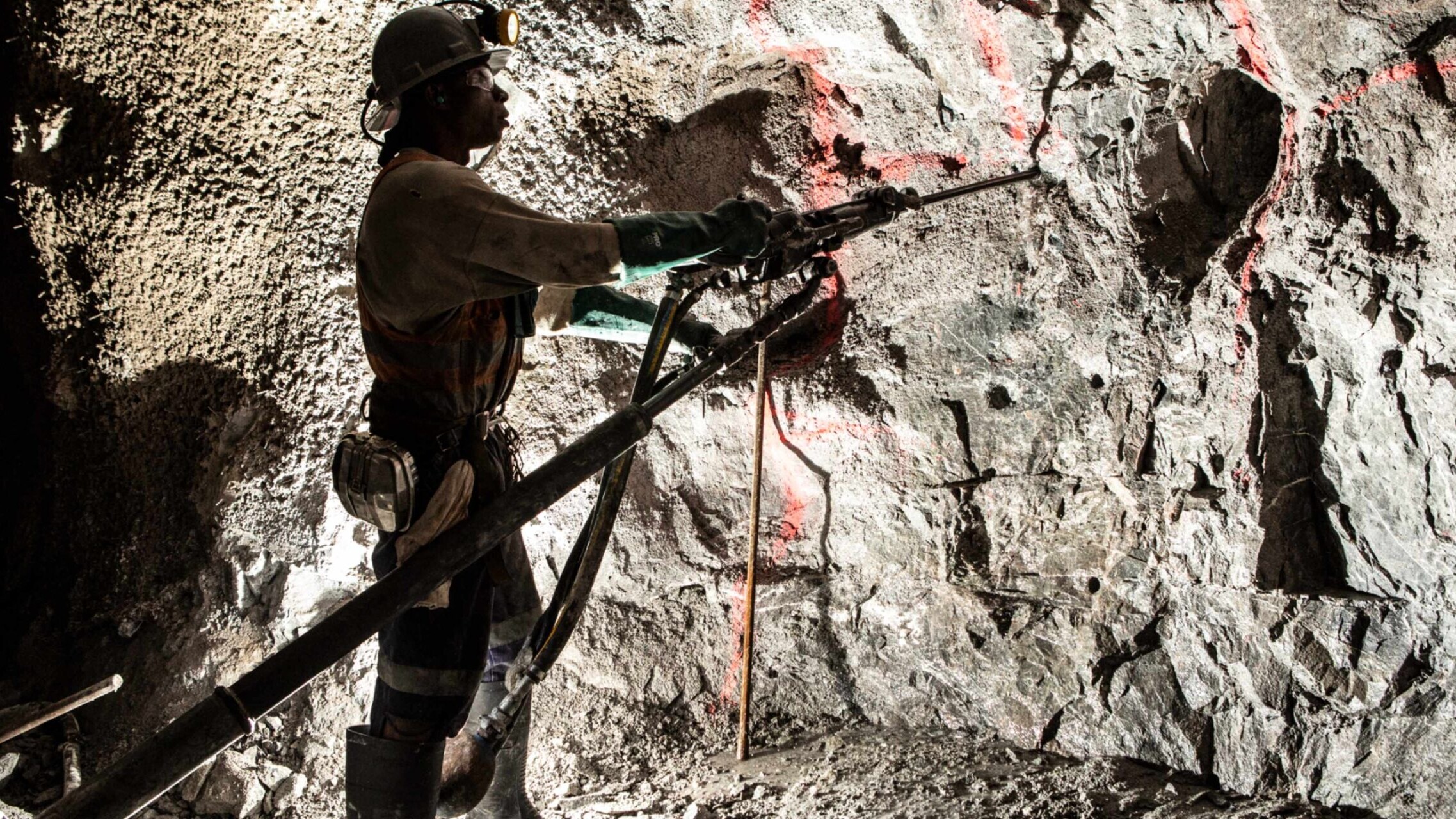 Man in coal mine wearing safety gear